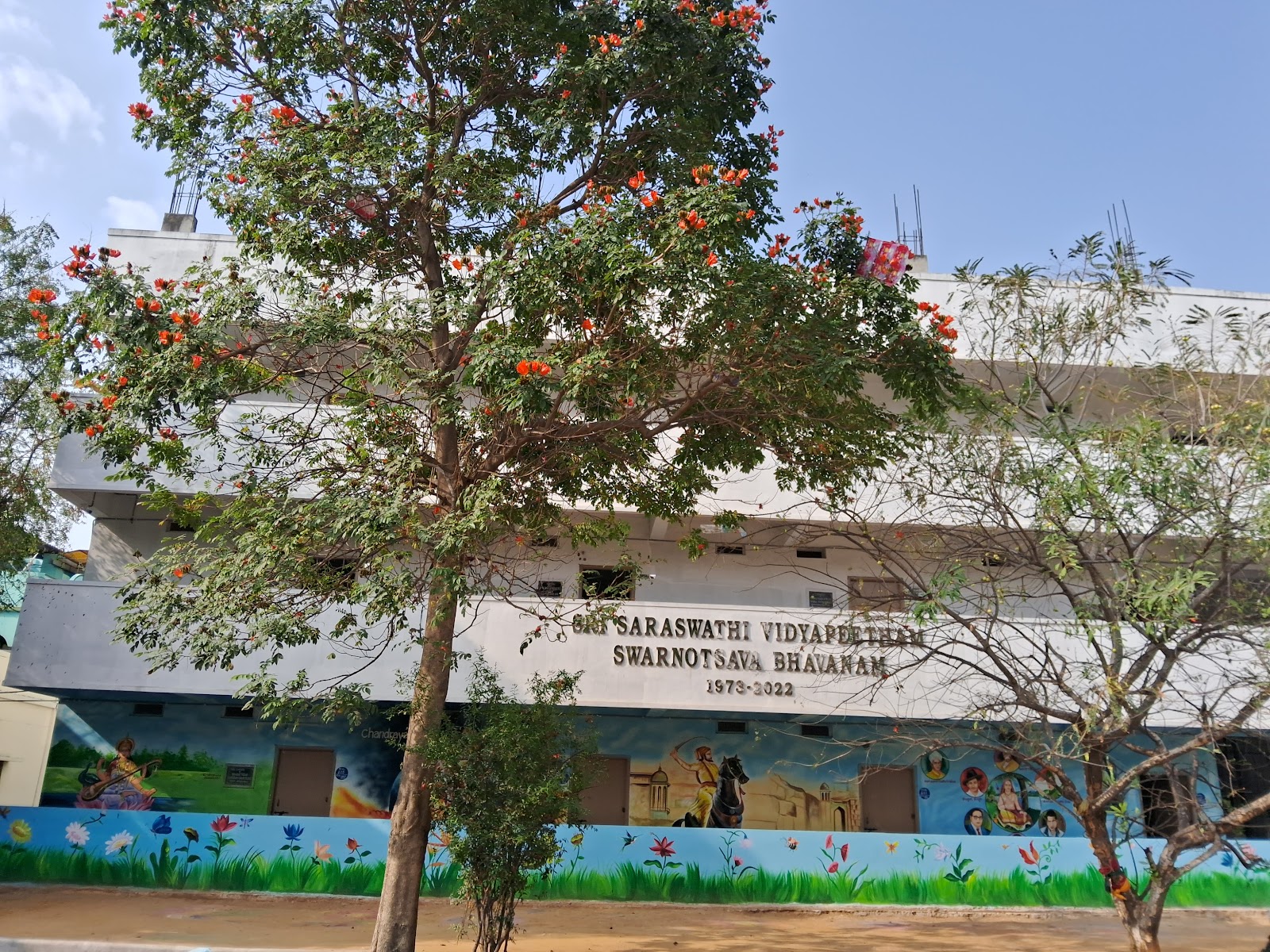 Front courtyard of the school with flowering trees